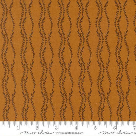 Image of Windfall Vine Stripe Caramel quilting cotton fabric by Fancy That Design House for Moda Fabric. Features vines on a brown background. Cute Little Fabric Shop.