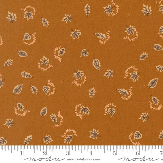 Image of Windfall Autumn Breeze Caramel quilting cotton fabric by Fancy That Design House for Moda Fabric. Features leaves on a brown background. Cute Little Fabric Shop.