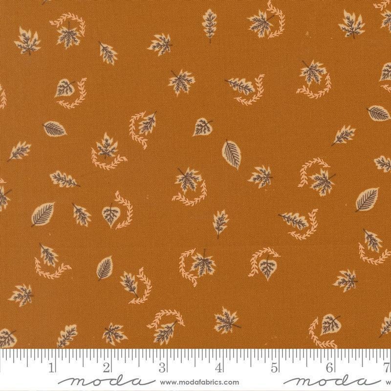 Image of Windfall Autumn Breeze Caramel quilting cotton fabric by Fancy That Design House for Moda Fabric. Features leaves on a brown background. Cute Little Fabric Shop.