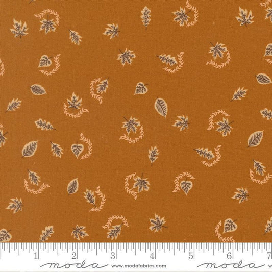 Image of Windfall Autumn Breeze Caramel quilting cotton fabric by Fancy That Design House for Moda Fabric. Features leaves on a brown background. Cute Little Fabric Shop.