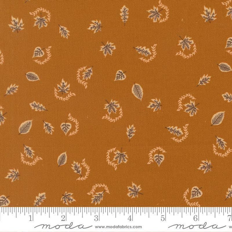 Image of Windfall Autumn Breeze Caramel quilting cotton fabric by Fancy That Design House for Moda Fabric. Features leaves on a brown background. Cute Little Fabric Shop.