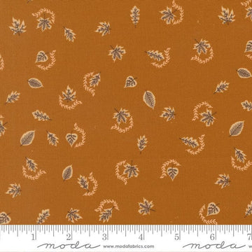 Image of Windfall Autumn Breeze Caramel quilting cotton fabric by Fancy That Design House for Moda Fabric. Features leaves on a brown background. Cute Little Fabric Shop.