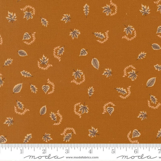 Image of Windfall Autumn Breeze Caramel quilting cotton fabric by Fancy That Design House for Moda Fabric. Features leaves on a brown background. Cute Little Fabric Shop.