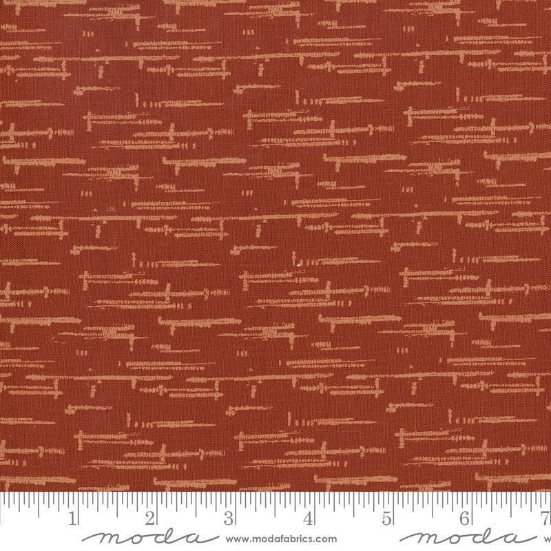Image of Windfall Textured Blender Rust quilting cotton fabric by Fancy That Design House for Moda Fabric. Features printed texture on a red background. Cute Little Fabric Shop.