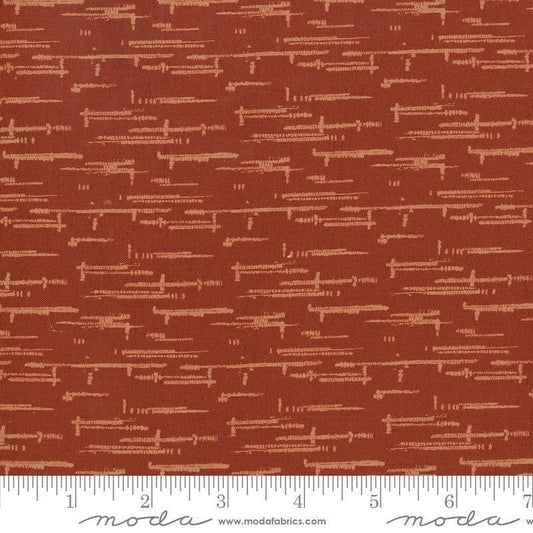 Image of Windfall Textured Blender Rust quilting cotton fabric by Fancy That Design House for Moda Fabric. Features printed texture on a red background. Cute Little Fabric Shop.