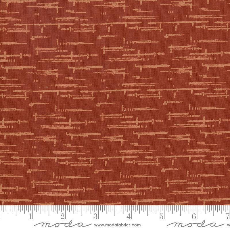 Image of Windfall Textured Blender Rust quilting cotton fabric by Fancy That Design House for Moda Fabric. Features printed texture on a red background. Cute Little Fabric Shop.