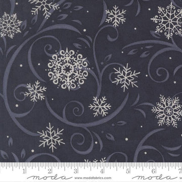 Image of When Snow Falls Swirling Snowflakes Night Sky quilting cotton fabric by Deb Strain for Moda Fabrics. Features snowflakes and swirls on a blue background. Cute Little Fabric Shop.