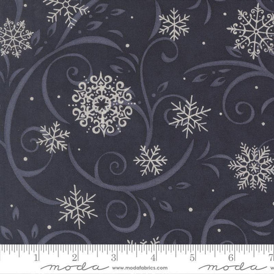 Image of When Snow Falls Swirling Snowflakes Night Sky quilting cotton fabric by Deb Strain for Moda Fabrics. Features snowflakes and swirls on a blue background. Cute Little Fabric Shop.