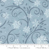 Image of When Snow Falls Swirling Snowflakes Winter Sky quilting cotton fabric by Deb Strain for Moda Fabrics. Features snowflakes and swirls on a blue background. Cute Little Fabric Shop.