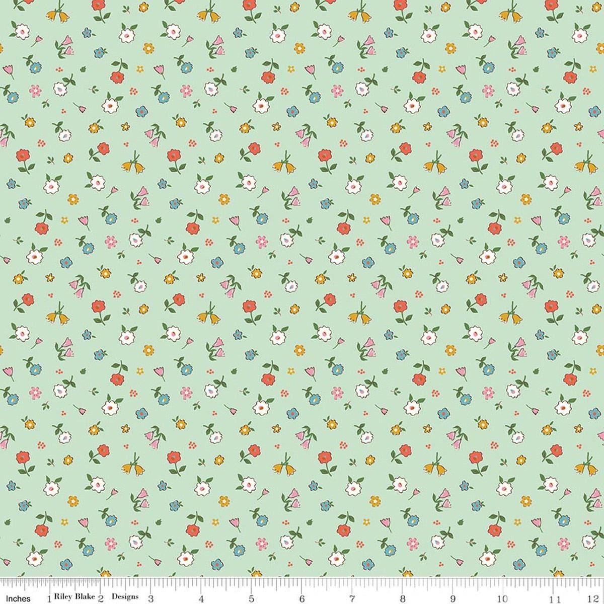 Image of Cotton Nook Pretty Mint quilting cotton fabric by Minki Kim for Riley Blake Designs. Features flowers on a green background. Cute Little Fabric Shop.