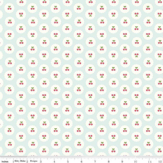Image of Cotton Nook Cherries Bleached Denim quilting cotton fabric by Minki Kim for Riley Blake Designs. Features cherries on a blue background. Cute Little Fabric Shop.