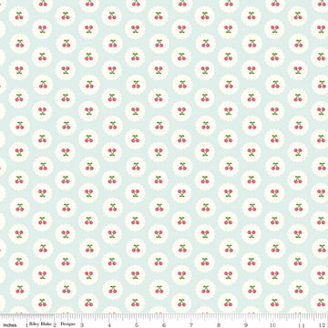 Image of Cotton Nook Cherries Bleached Denim quilting cotton fabric by Minki Kim for Riley Blake Designs. Features cherries on a blue background. Cute Little Fabric Shop.