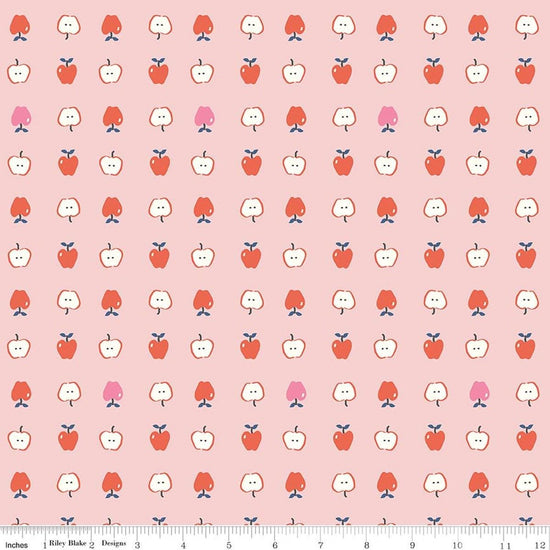 Image of Cotton Nook Apples Pink quilting cotton fabric by Minki Kim for Riley Blake Designs. Features apples on a pink background. Cute Little Fabric Shop.