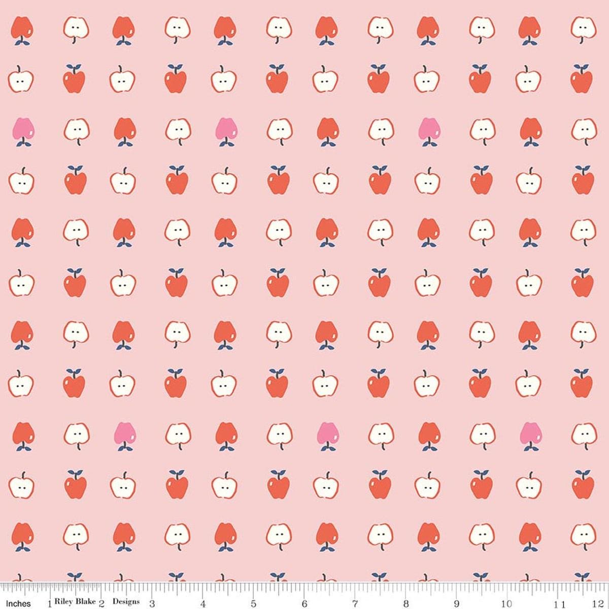 Image of Cotton Nook Apples Pink quilting cotton fabric by Minki Kim for Riley Blake Designs. Features apples on a pink background. Cute Little Fabric Shop.