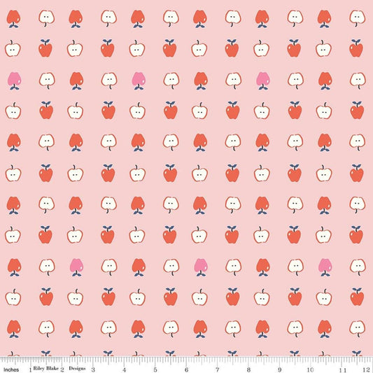 Image of Cotton Nook Apples Pink quilting cotton fabric by Minki Kim for Riley Blake Designs. Features apples on a pink background. Cute Little Fabric Shop.