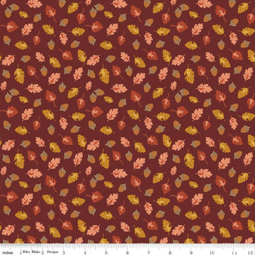 Image of Cozy Autumn Acorns & Oak Leaves Dark Rust quilting cotton fabric by Beverly McCullough for Riley Blake Designs. Features leaves and acorns on a brownish red background. Cute Little Fabric Shop.