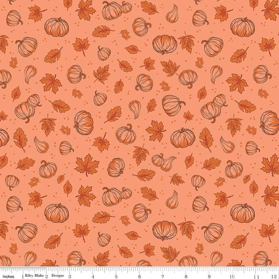 Image of Cozy Autumn Pumpkins Melon quilting cotton fabric by Beverly McCullough for Riley Blake Designs. Features pumpkins and leaves on a pinky orange background. Cute Little Fabric Shop.