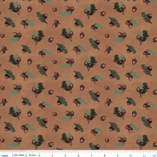 Image of Whispering Pines Acorns Brown quilting cotton fabric by The RBD Designers for Riley Blake Designs. Features acorns and leaves on a brown background. Cute Little Fabric Shop.
