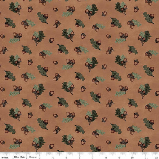 Image of Whispering Pines Acorns Brown quilting cotton fabric by The RBD Designers for Riley Blake Designs. Features acorns and leaves on a brown background. Cute Little Fabric Shop.