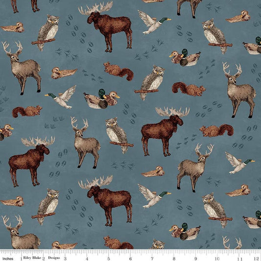 Image of Whispering Pines Animal Toss Blue quilting cotton fabric by The RBD Designers for Riley Blake Designs. Features animals on a blue background. Cute Little Fabric Shop.