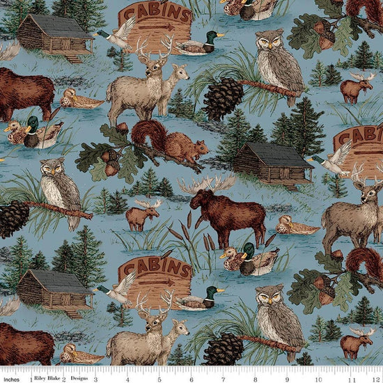 Image of Whispering Pines Main Blue quilting cotton fabric by The RBD Designers for Riley Blake Designs. Features animals on a blue background. Cute Little Fabric Shop.