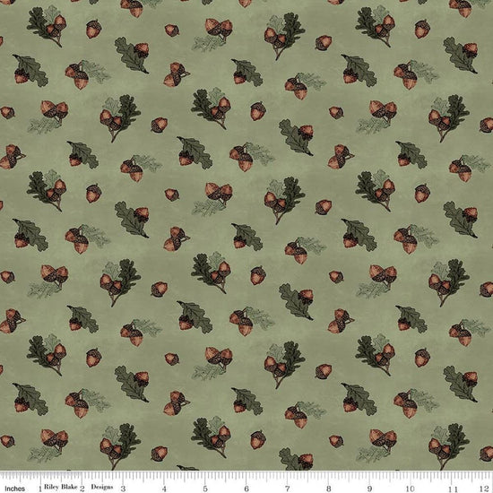 Image of Whispering Pines Acorns Green quilting cotton fabric by The RBD Designers for Riley Blake Designs. Features acorns and leaves on a green background. Cute Little Fabric Shop.