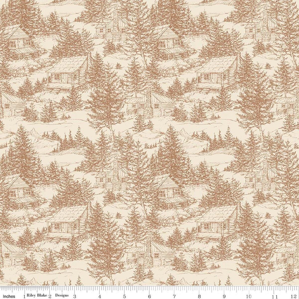 Image of Whispering Pines Cabins Brown quilting cotton fabric by The RBD Designers for Riley Blake Designs. Features cabins in a forest on a cream background. Cute Little Fabric Shop.