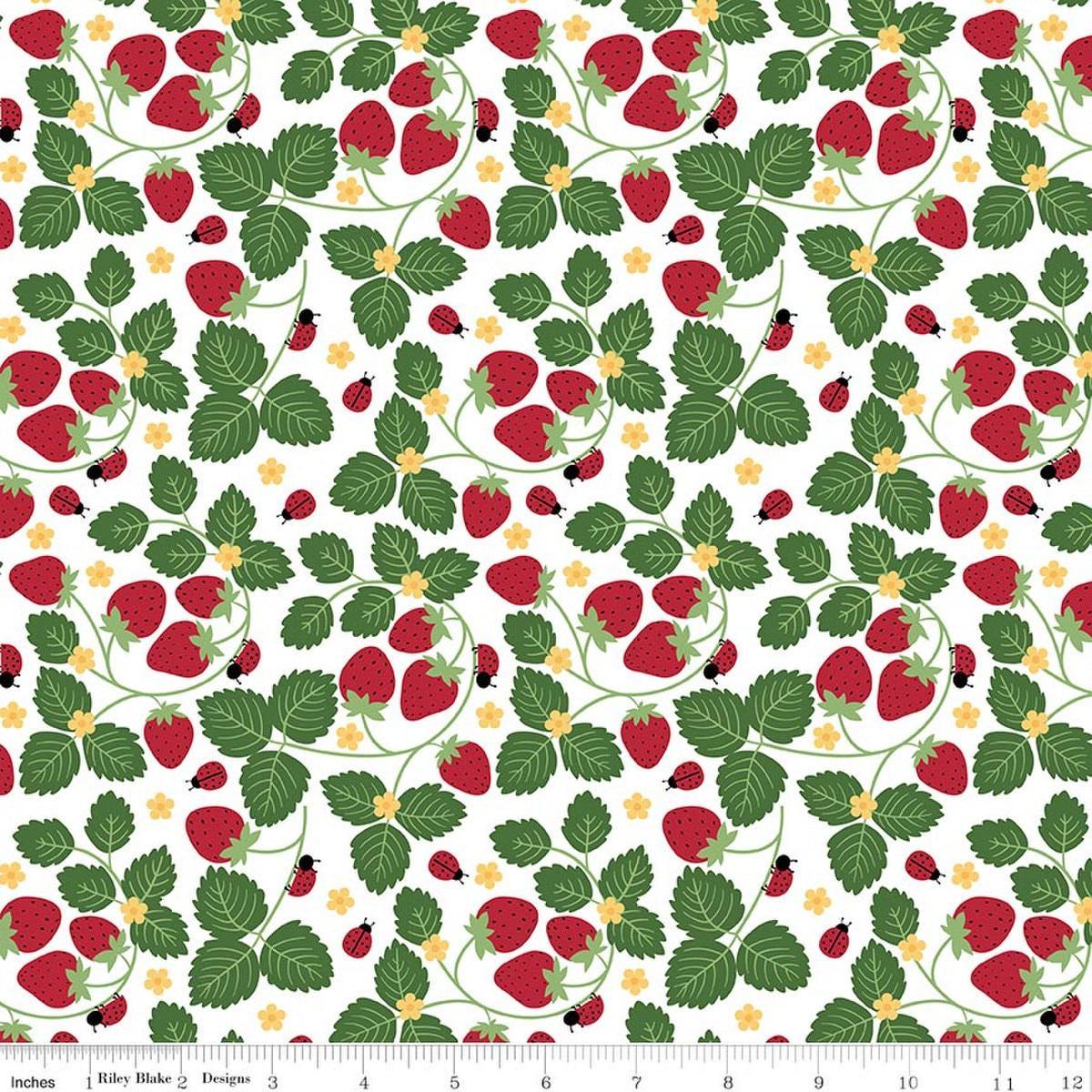 Image of Little Ladybug Strawberries White quilting cotton fabric by Lori Whitlock for Riley Black Designs. Features strawberries and leaves on a white background. Cute Little Fabric Shop.