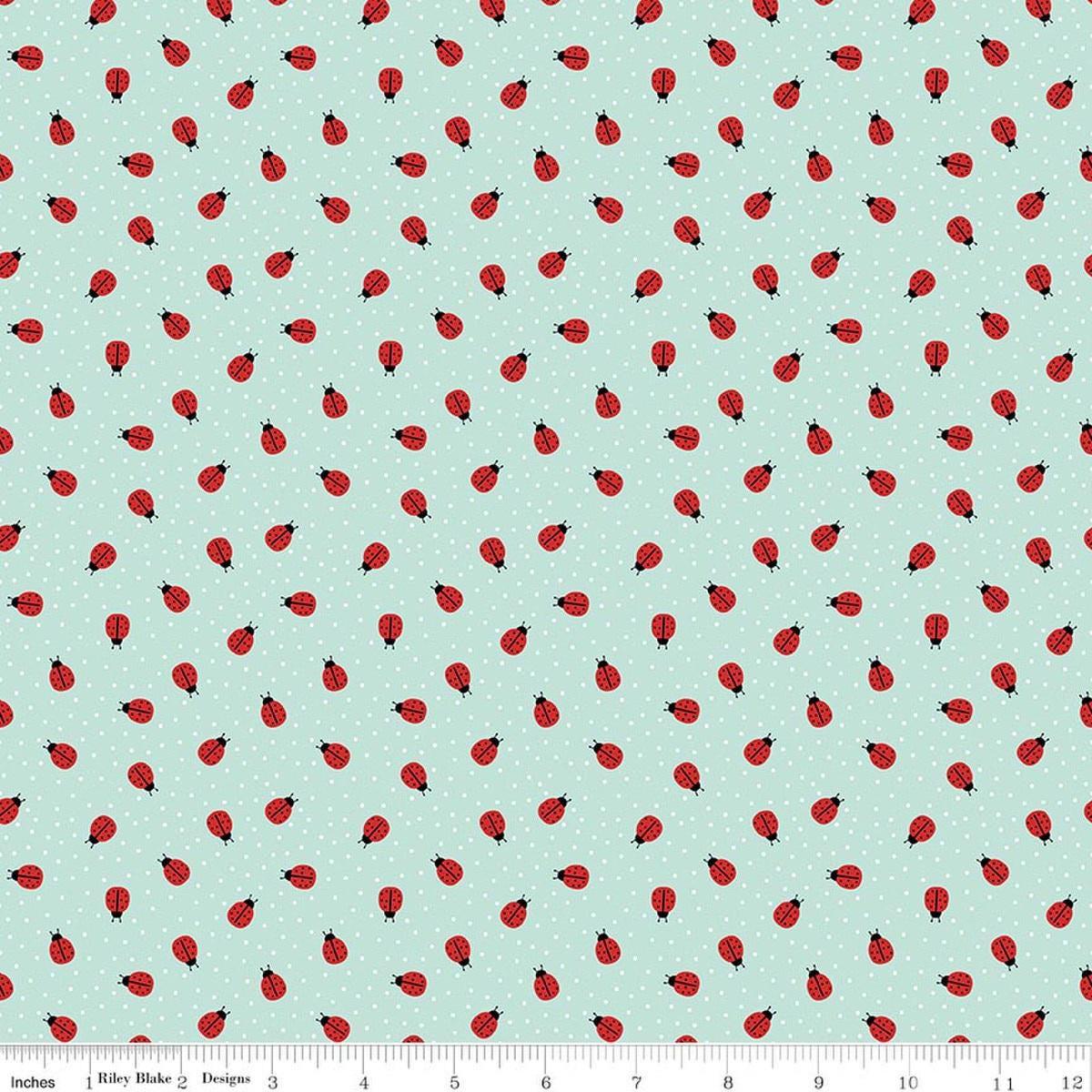 Image of Little Ladybug Ladybugs Blue quilting cotton fabric by Lori Whitlock for Riley Black Designs. Features ladybugs on a blue background. Cute Little Fabric Shop.