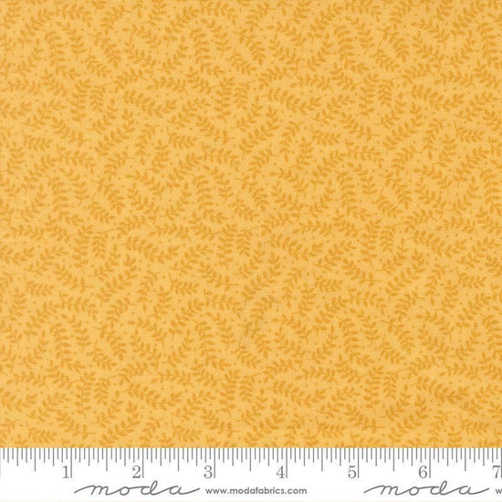 Image of My Secret Garden Crawling Vines Sunflower quilting cotton fabric by Stacy Iest Hsu for Moda Fabrics. Features leaves on a yellow background. Cute Little Fabric Shop.