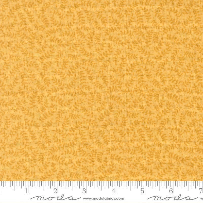 Image of My Secret Garden Crawling Vines Sunflower quilting cotton fabric by Stacy Iest Hsu for Moda Fabrics. Features leaves on a yellow background. Cute Little Fabric Shop.
