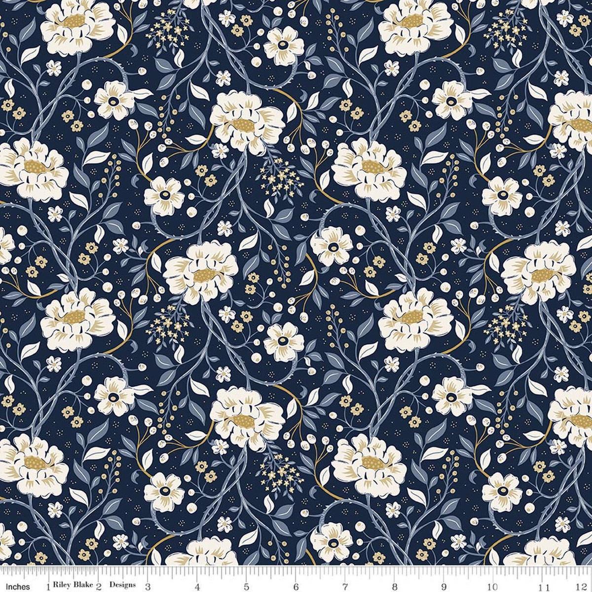 Image of Before the Blooms Main Indigo quilting cotton fabric by Danelys Sidron for Riley Blake Designs. Features flowers on a blue background. Cute Little Fabric Shop.