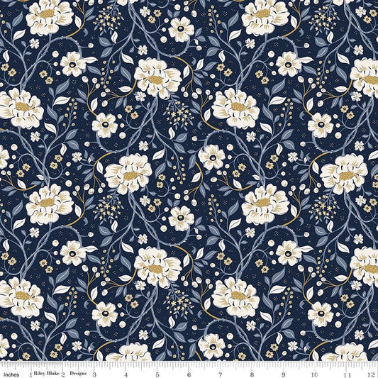 Image of Before the Blooms Main Indigo quilting cotton fabric by Danelys Sidron for Riley Blake Designs. Features flowers on a blue background. Cute Little Fabric Shop.