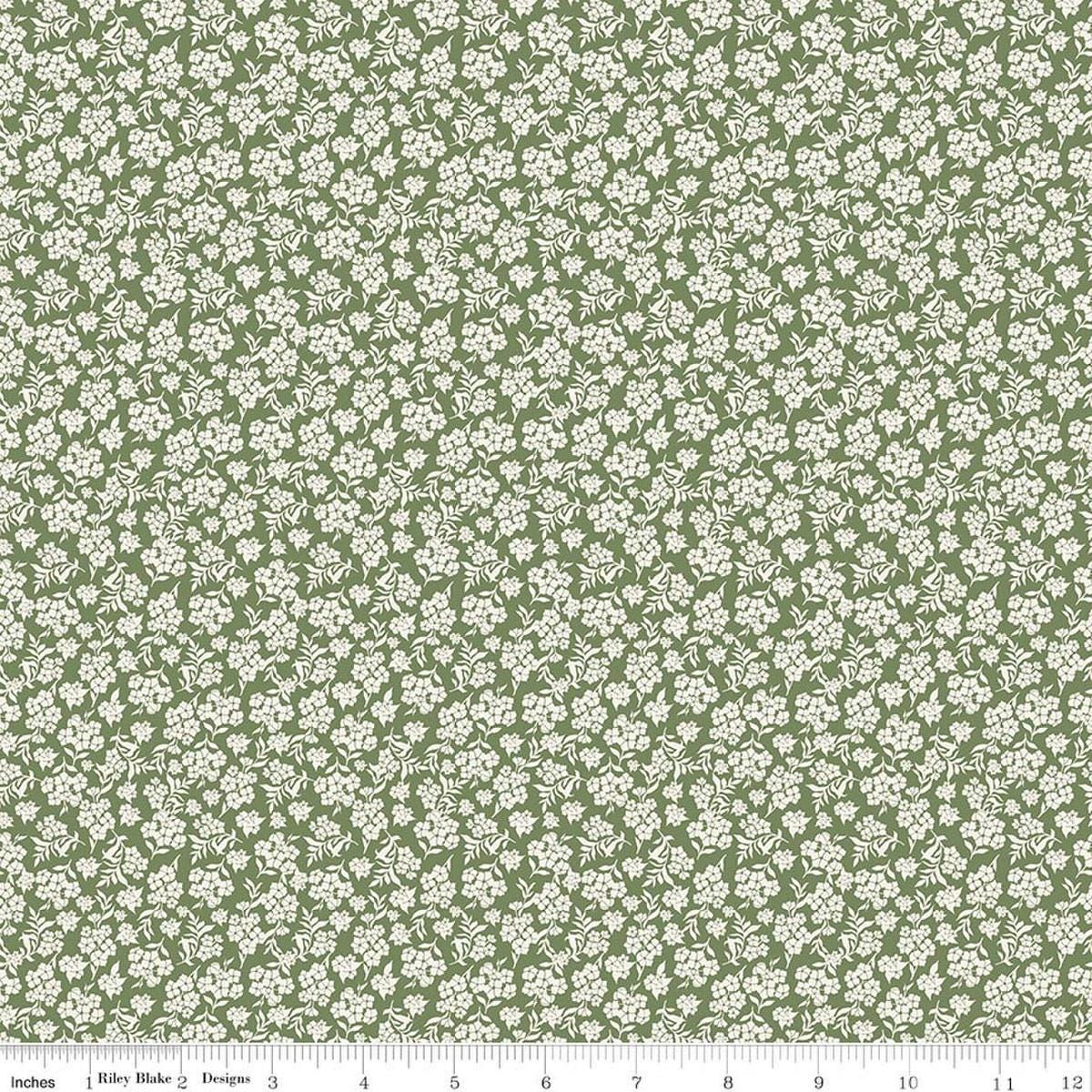 Image of Before the Blooms Viola Basil quilting cotton fabric by Danelys Sidron for Riley Blake Designs. Features flowers on a green background. Cute Little Fabric Shop.