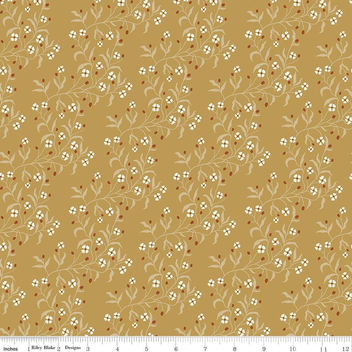 Image of Before the Blooms Astrid Gold quilting cotton fabric by Danelys Sidron for Riley Blake Designs. Features flowers on a gold background. Cute Little Fabric Shop.