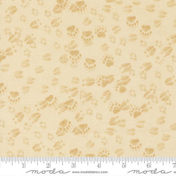 Image of Northwoods Lodge Animal Tracks Natural quilting cotton fabric by Deb Strain for Moda Fabrics. Features animal footprints on a cream background. Cute Little Fabric Shop.