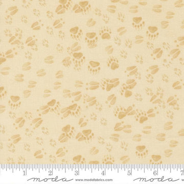 Image of Northwoods Lodge Animal Tracks Natural quilting cotton fabric by Deb Strain for Moda Fabrics. Features animal footprints on a cream background. Cute Little Fabric Shop.