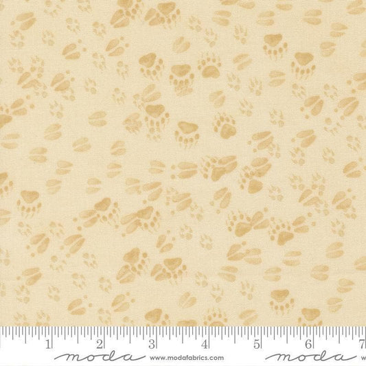 Image of Northwoods Lodge Animal Tracks Natural quilting cotton fabric by Deb Strain for Moda Fabrics. Features animal footprints on a cream background. Cute Little Fabric Shop.