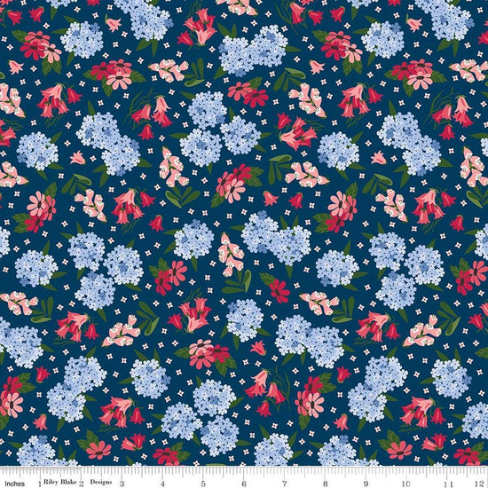 Image of Foxglove Main Oxford Blue quilting cotton fabric by Jill Finley for Riley Blake Designs. Features flowers on a blue background. Cute Little Fabric Shop.