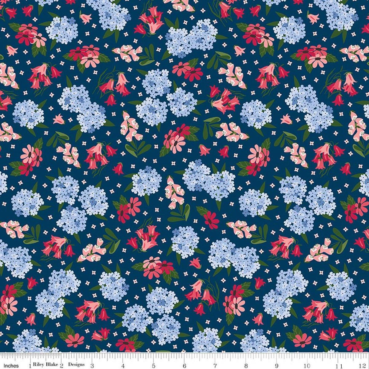 Image of Foxglove Main Oxford Blue quilting cotton fabric by Jill Finley for Riley Blake Designs. Features flowers on a blue background. Cute Little Fabric Shop.