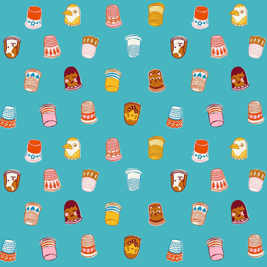 Image of 1 800 Notion Thimbles Turquoise quilting cotton fabric by Ruby Star Society for Moda Fabrics. Features sewing accessories on a blue background. Cute Little Fabrics Shop.