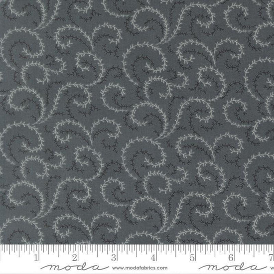 Image of Breathtaking Blues Vine Dusk quilting cotton fabric by 3 Sisters for Moda Fabrics. Features leaves on a dark gray background. Cute Little Fabric Shop.