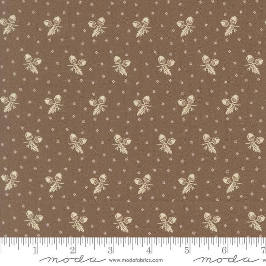 Image of Butternut and Sage Acorn Medley Walnut quilting cotton fabric by Fig Tree Co for Moda Fabrics. Features acorns and dots on a brown background. Cute Little Fabric Shop.