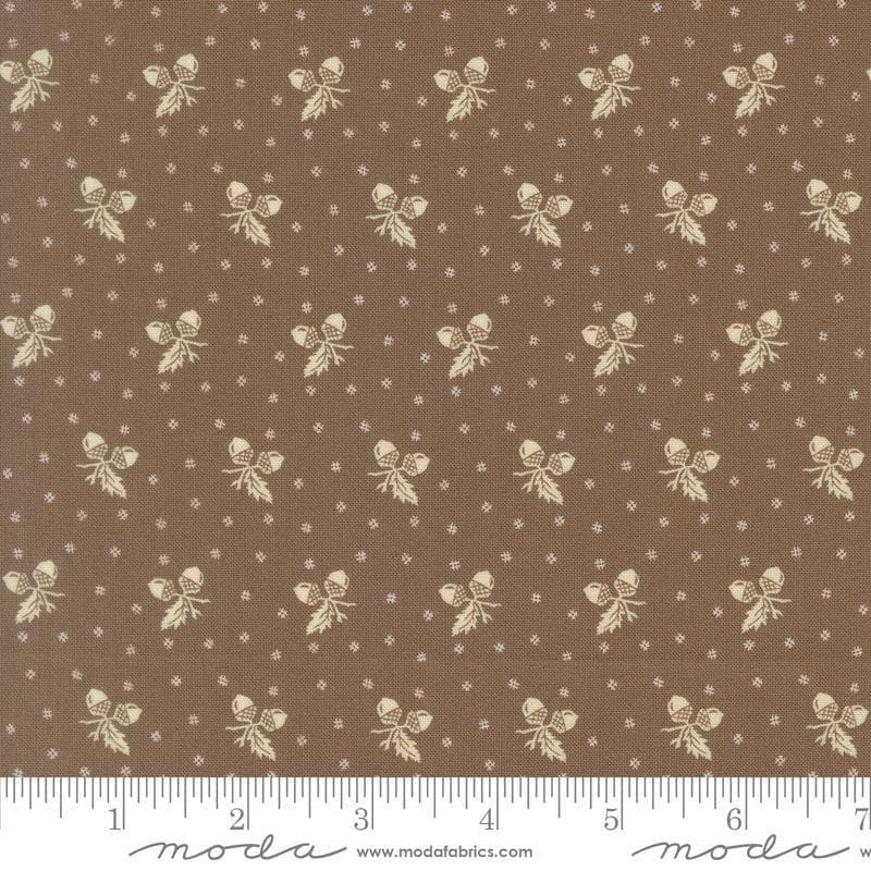 Image of Butternut and Sage Acorn Medley Walnut quilting cotton fabric by Fig Tree Co for Moda Fabrics. Features acorns and dots on a brown background. Cute Little Fabric Shop.