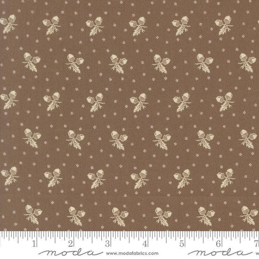 Image of Butternut and Sage Acorn Medley Walnut quilting cotton fabric by Fig Tree Co for Moda Fabrics. Features acorns and dots on a brown background. Cute Little Fabric Shop.