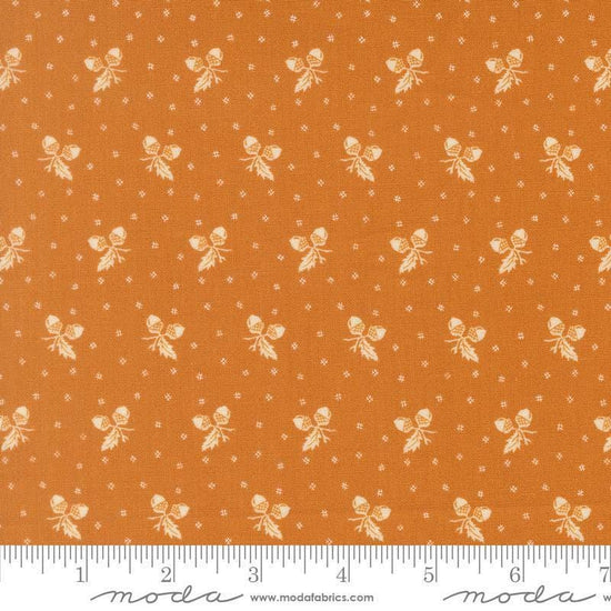 Image of Butternut and Sage Acorn Medley Butterscotch quilting cotton fabric by Fig Tree Co for Moda Fabrics. Features acorns and dots on an orange background. Cute Little Fabric Shop.