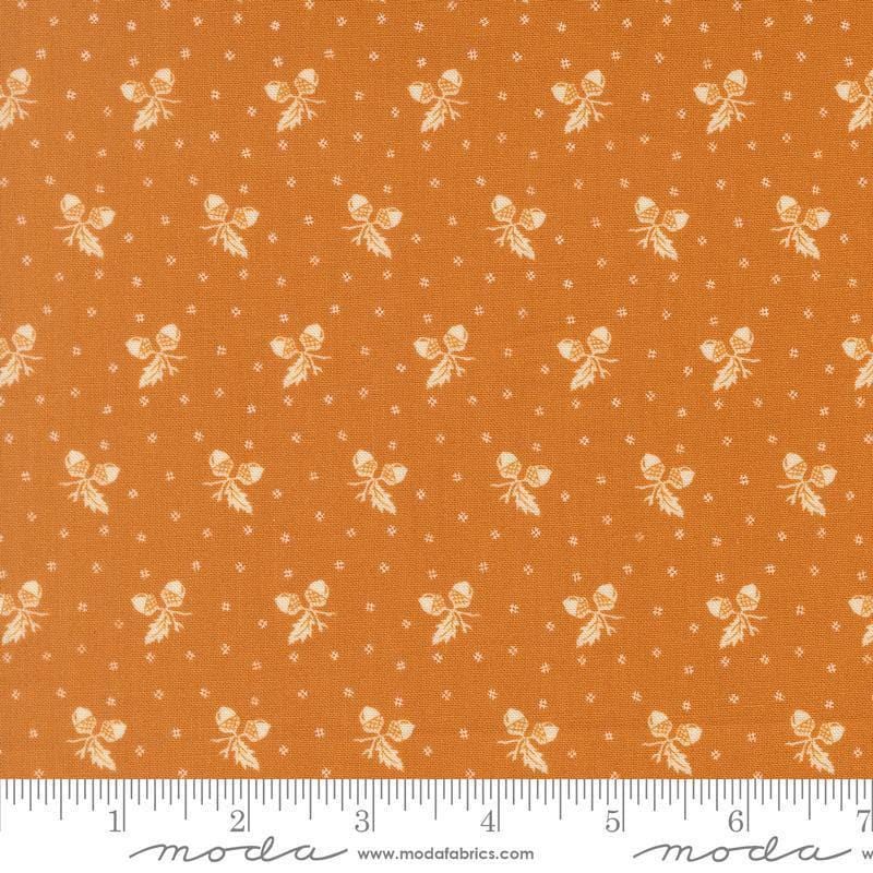 Image of Butternut and Sage Acorn Medley Butterscotch quilting cotton fabric by Fig Tree Co for Moda Fabrics. Features acorns and dots on an orange background. Cute Little Fabric Shop.