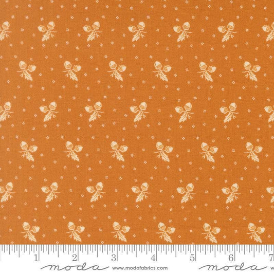 Image of Butternut and Sage Acorn Medley Butterscotch quilting cotton fabric by Fig Tree Co for Moda Fabrics. Features acorns and dots on an orange background. Cute Little Fabric Shop.