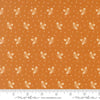 Image of Butternut and Sage Acorn Medley Butterscotch quilting cotton fabric by Fig Tree Co for Moda Fabrics. Features acorns and dots on an orange background. Cute Little Fabric Shop.