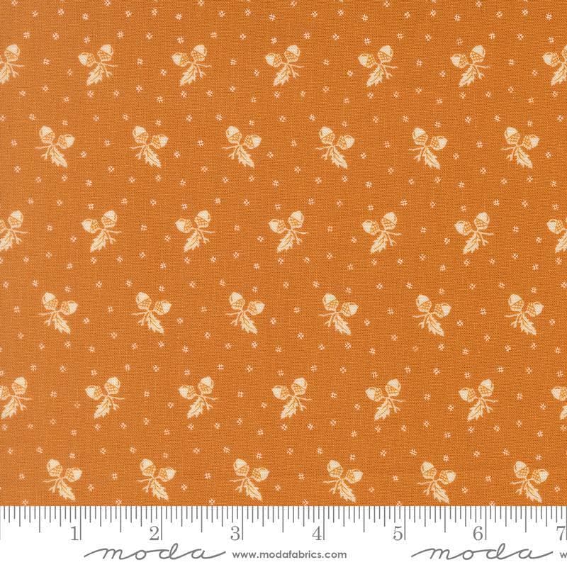 Image of Butternut and Sage Acorn Medley Butterscotch quilting cotton fabric by Fig Tree Co for Moda Fabrics. Features acorns and dots on an orange background. Cute Little Fabric Shop.